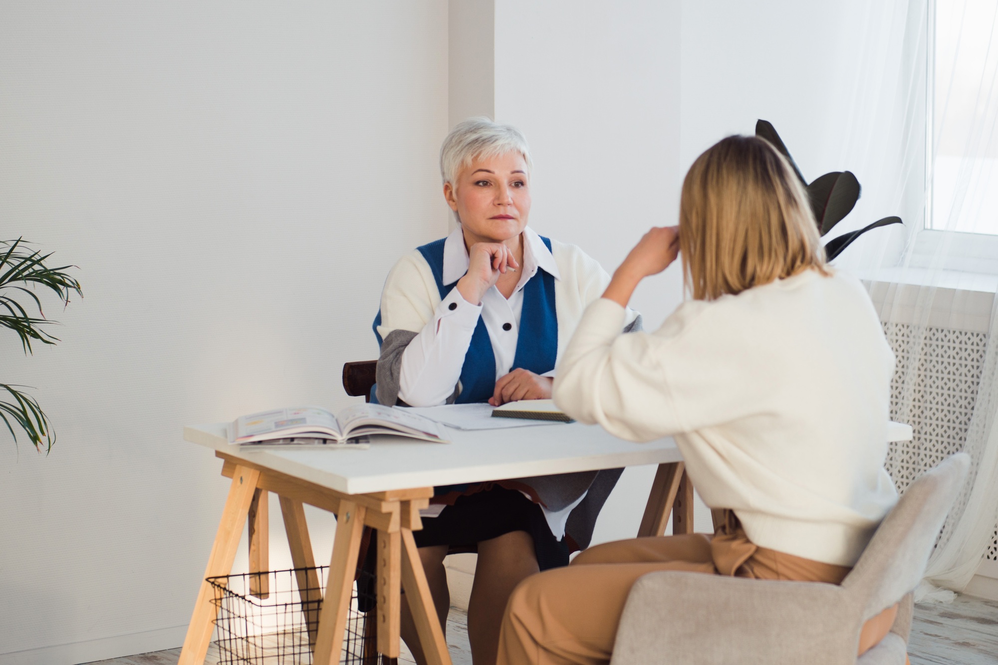 Woman psychologist and client communicating